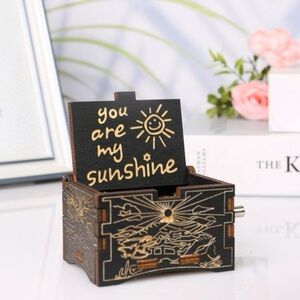 Wooden engraved music box. New.